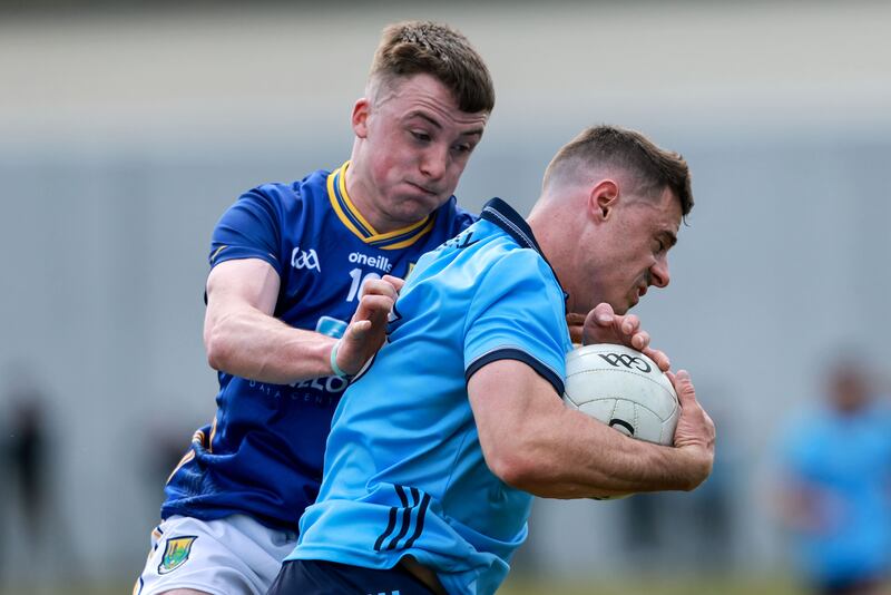 Dublin’s Brian Howard comes up against John Paul Nolan of Wicklow. Photograph: Dan Sheridan/Inpho