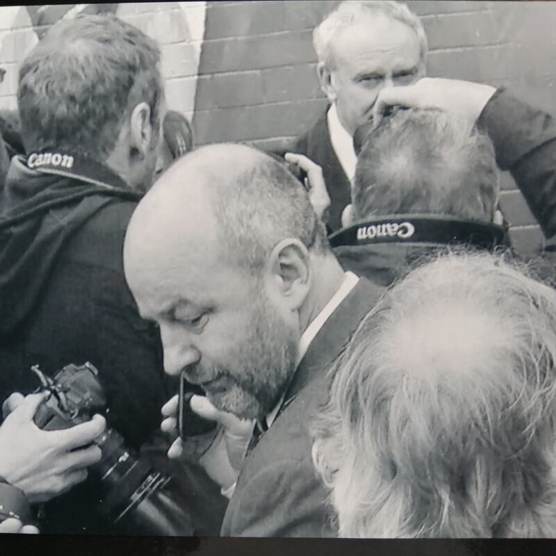 Brian Rowan pictured with other journalists, with Sinn Féin's Martin McGuinness in the background, in 2014. Photograph: Twitter