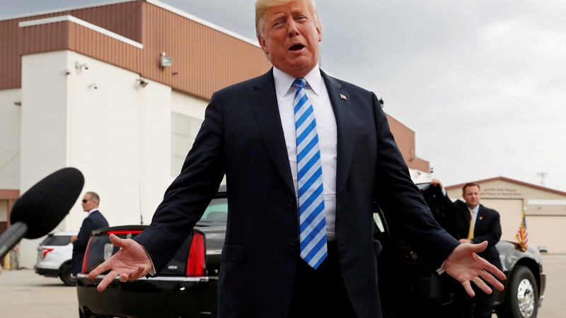 US president Donald Trump speaks to the news media  about the  conviction of his former  campaign chairman Paul Manafort as the president arrives for a campaign event in Charleston, West Virginia, on Tuesday. Photograph: Leah Millis/Reuters