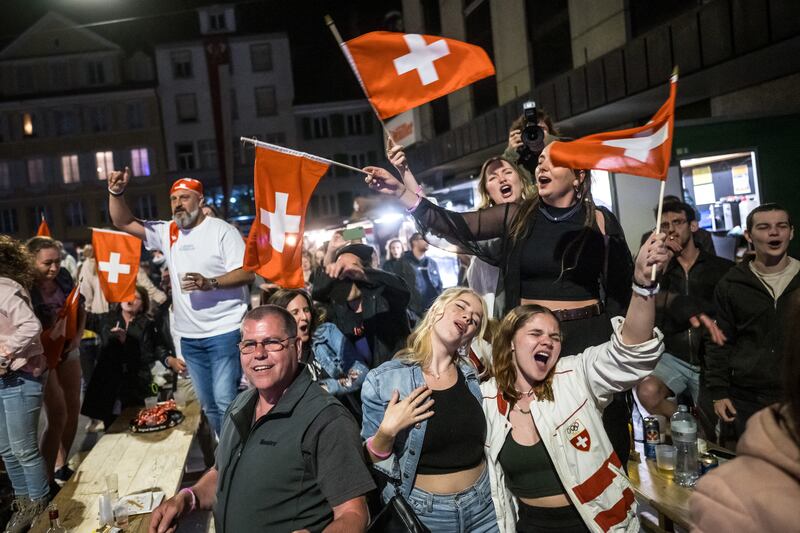Swiss supporters react after singer Nemo wins the Eurovision final. Nemo was born in the city. Photograph: FABRICE COFFRINI/AFP via Getty Images