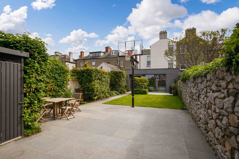 The rear space is being used as a basketball court but could serve other purposes