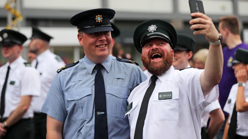 A member of the PSNI and  Garda take a selfie together at the start of the Belfast Pride parade. Photograph: Niall Carson/PA Wire
