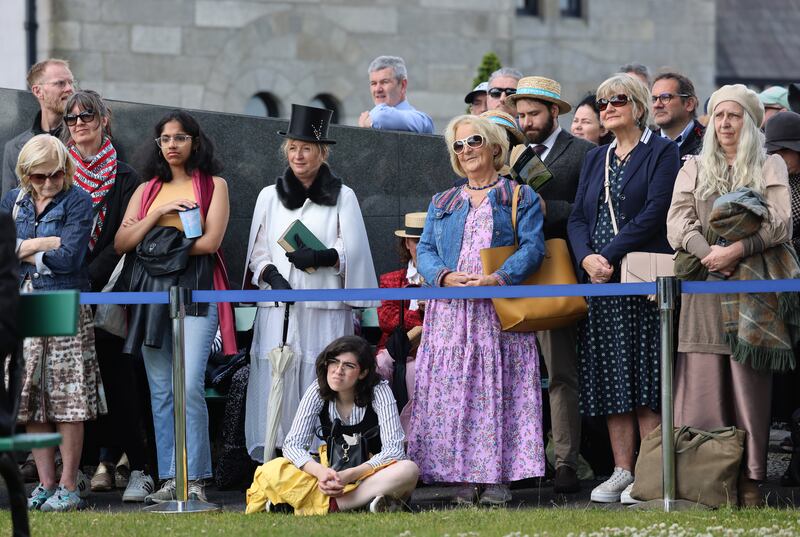 People watching the JoyceStagers perform at Glasnevin Cemetery in Dublin to celebrate Bloomsday. Photograph: Dara Mac Dónaill








