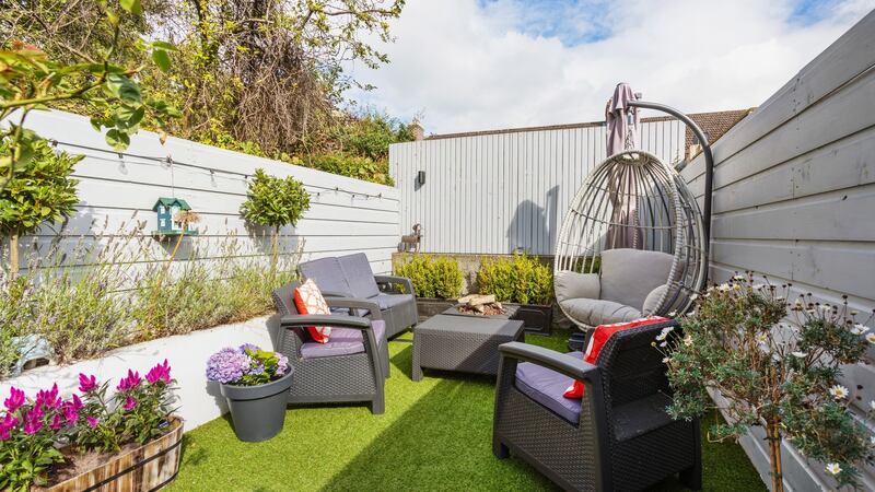 Low-maintenance garden with astro turf.
