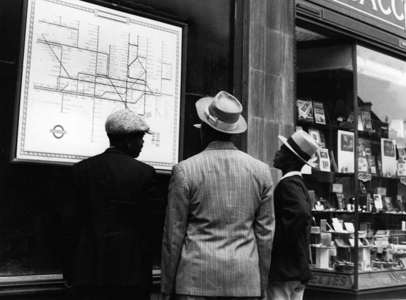 A group of Jamaican immigrants new to London scrutinise a map of the Underground. Photograph: Getty Images