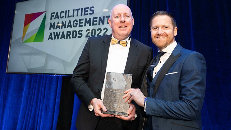 Stephen Mills, Head of Corporate, Aiken Insurances, presents the FM Team of the Year - Service Provider Award to Greg Wilson, Sensori FM.