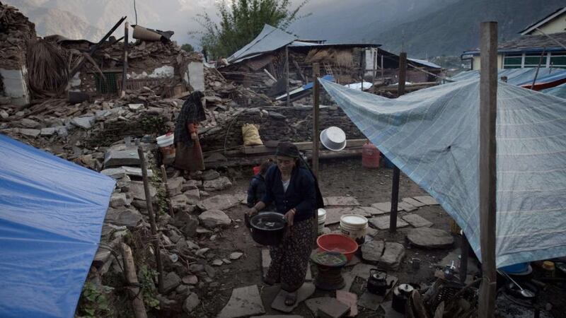 A resident walks through tents set up near destroyed houses in the village of Barpak in north central Nepal, nine days after a 7.8 magnitude earthquake struck the Himalayan nation on April 25th. Photograph: COLAS ASFOURI/AFP/Getty Images