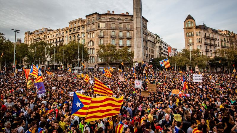 Protesters march along Passeig de Gracia avenue in Barcelona waving pro-independence Catalan Estelada flags. Photograph: Angel Garcia/Bloomberg.