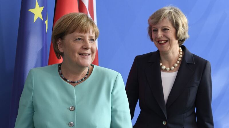 Angela Merkel and Theresa May. Photograph: John MacDougall/AFP/Getty