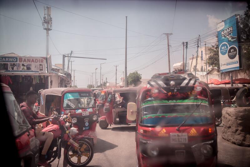 Daily life in Mogadishu, Somalia, as seen through a bulletproof car window. Many foreigners travel around the city in bulletproof cars. Photograph: Sally Hayden