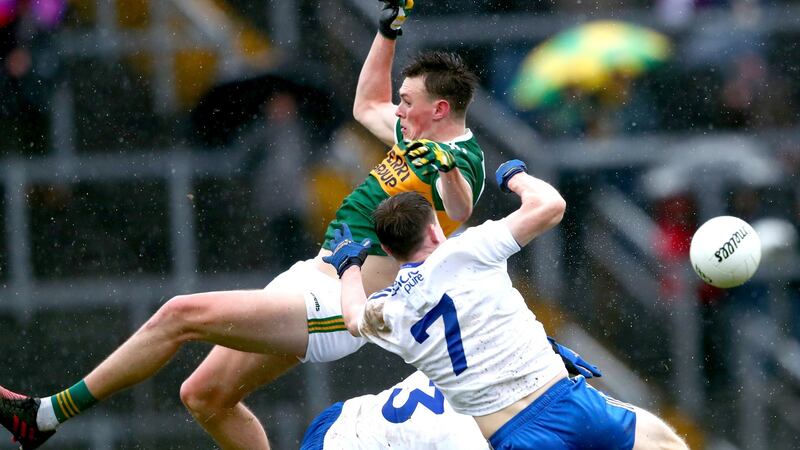 Monaghan’s Karl O’Connell and Drew Wylie with Gavin O’Brien of Kerry. Photo: James Crombie/Inpho