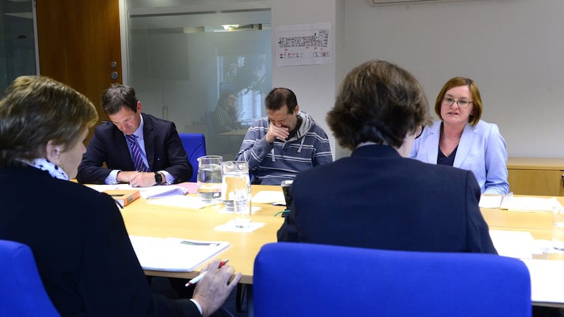 Pictured during the mock mental health tribunal Ann Donnell (tribunal chair, back to camera) with, left, John Neville, the patient’s legal representative, patient John Doe (played by actor) and Dr Fiona Fenton (patient’s responsible consultant psychiatrist). Photograph: Cyril Byrne