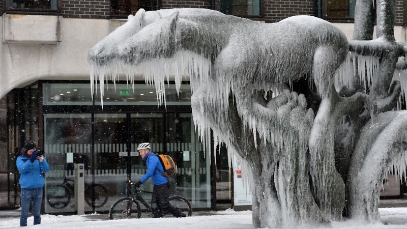 The sculpture Fountain at the Irish Life Building in Dublin is gripped by frozen icicles during the snowfall associated with Storm Emma, aka the Beast from the East. Photograph: Alan Betson