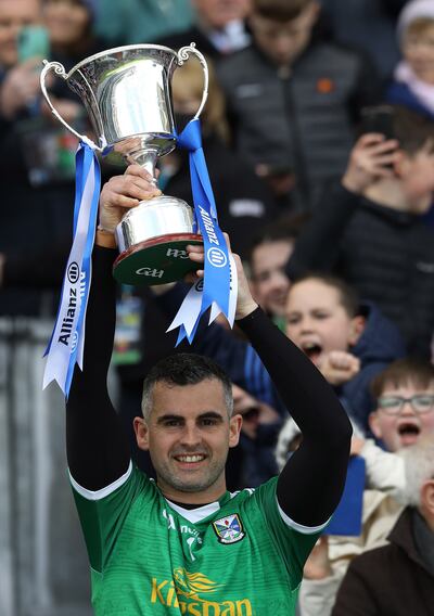 Raymond Galligan lifts the Division Four trophy. Photograph: Lorraine O’Sullivan/Inpho