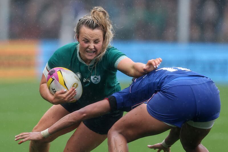 Ireland's Aoife Dalton is tackled by France's Kelly Arbey. Photograph: Dan Sheridan/Inpho