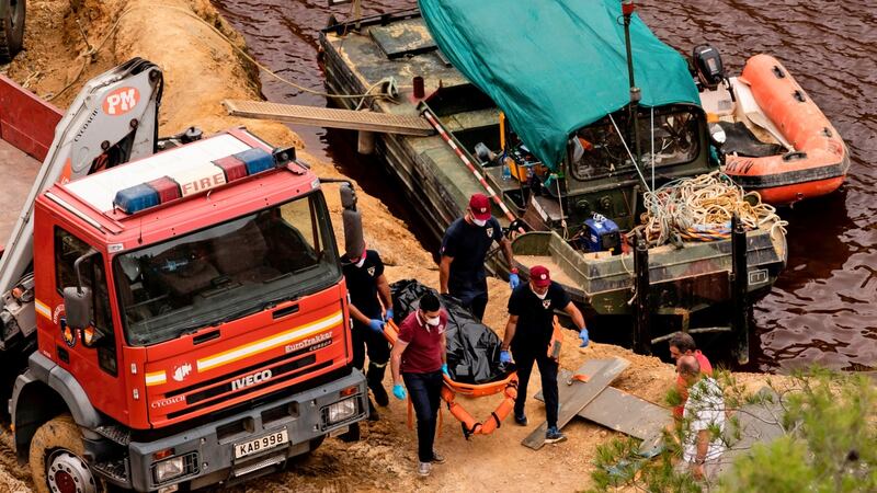 Cypriot investigators remove the body of one of the victims of Greek Cypriot serial killer Nicos Metaxas, recovered at the bottom of the man-made Red Lake out of the village of Mitsero, southwest of  Nicosi. Photograph: Iakovos Hatzistavrou/AFP/Getty Images