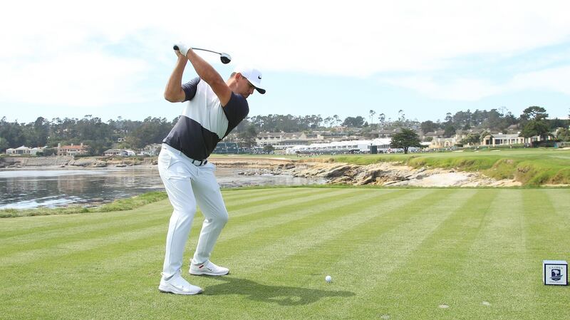 Brooks Koepka tees off on the 18th. Photo: Andrew Redington/Getty Images