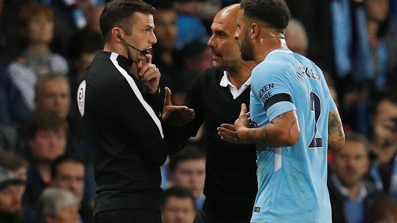 Pep Guardiola and Kyle Walker protest the fullback’s sending off aginast Everton. Photograph: Phil Noble/Reuters