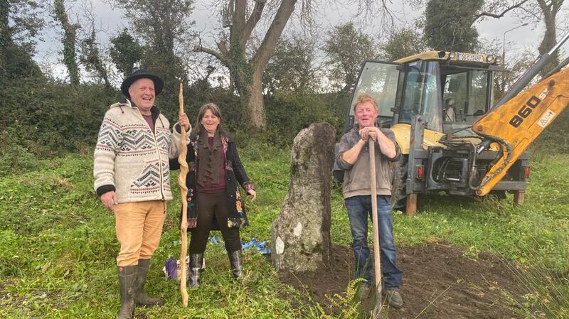 Druids Jan and Karen Tetteroo with Donal Bohane reinstalling the ancient stone on his farm in Skibbereen. ‘He wanted to restore the stone, and also restore his fortunes, because he had had a run of bad luck.’  Photograph: Dan Connolly
