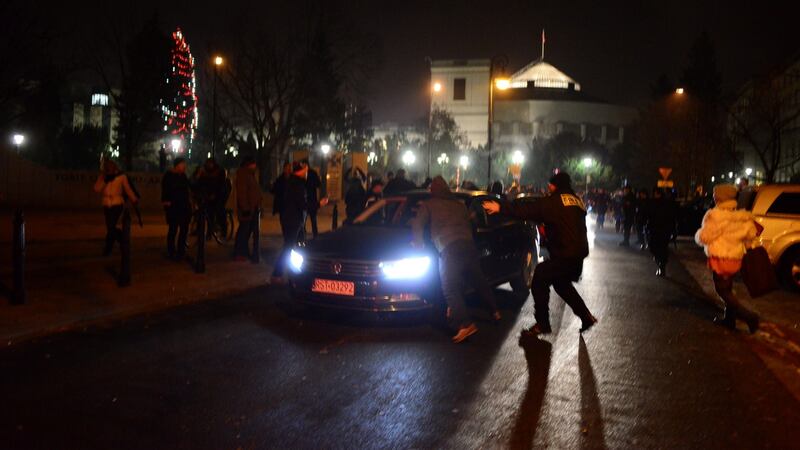 Protesters try to block the exit of the Polish Parliament in Warsaw. Michal Jazwiecki/via Reuters