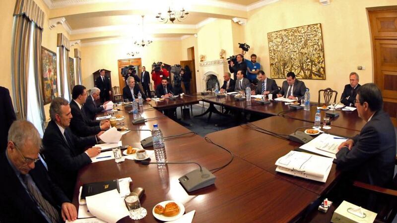 Cypriot president Nicos Anastasiades (R) and his cabinet sit at a meeting at the presidental palace in Nicosia. Photograph: Reuters