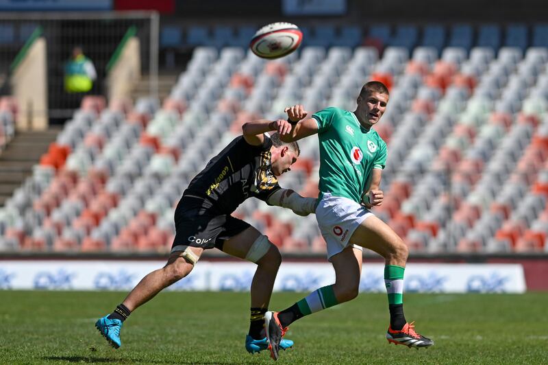 Sam Prendergast offloads despite the attempted tackle of Western Force's Will Harris during the game in Bloemfontein. Photograph: Darren Stewart/Inpho/Steve Haag Sports