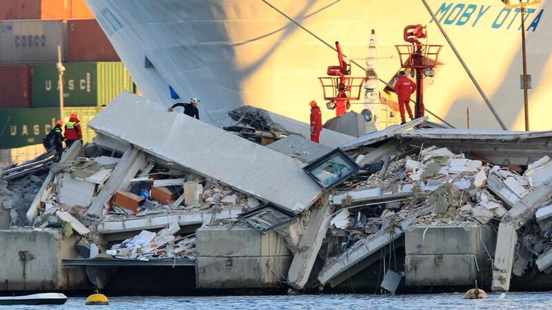 At least three people were killed and six injured when a container ship rammed a control tower in the northern Italian port city of Genoa. Photograph: Alessandro Garofalo/Reuters