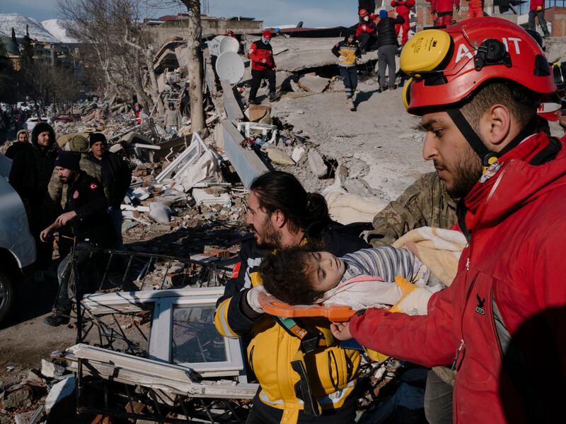Rescue workers carry Vacit Amuri, a three-year-old girl who was found alive amidst the rubble of a collapsed building, on a stretcher in Kahramanmaras, Turkey on Tuesday. Photograph: Emin Ozmen/New York Times