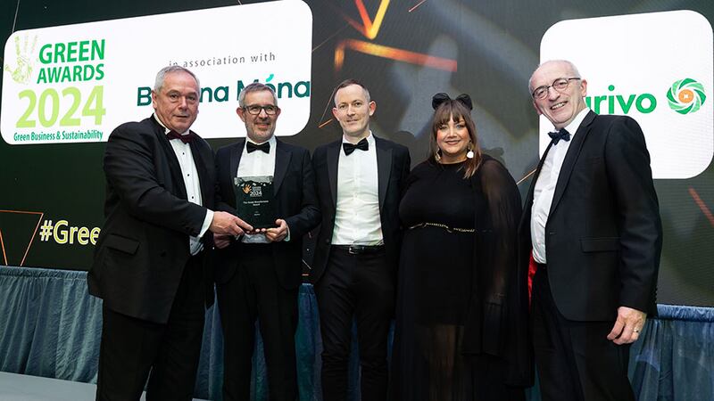 Mark Keogh, sales director at Schneider Electric, presents the green manufacturer award to Aurivo team