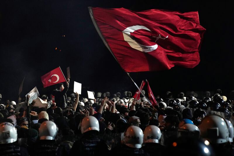 Anti-riot police officers and protesters in Istanbul, Turkey. Photograph: Khalil Hamra/AP