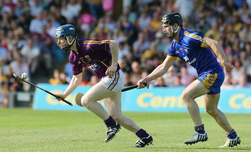 Clare's Domhnall O'Donovan tracks Rory Jacob of Wexford during the 2013 All-Ireland championship. Photograph: Lorraine O'Sullivan/Inpho 