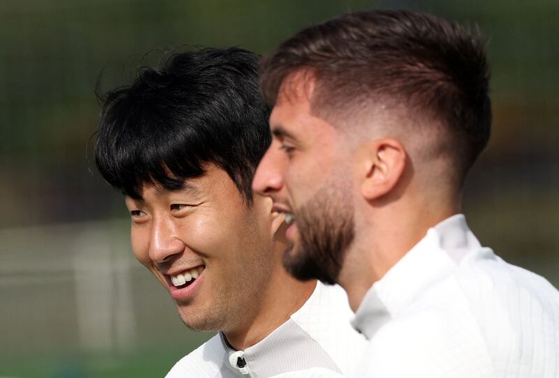 Tottenham Hotspur's South Korean striker Son Heung-Min (L) and Tottenham Hotspur's Uruguayan midfielder Rodrigo Bentancur attend a team training session at Tottenham Hotspur Football Club Training Ground in north London on October 3, 2022 on the eve of their UEFA Champions League Group D football match against Eintracht Frankfurt. (Photo by Adrian DENNIS / AFP) (Photo by ADRIAN DENNIS/AFP via Getty Images)
