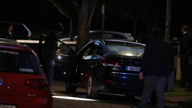 Gardaí on Whitechapel Grove in west Dublin tonight, after an armed siege there. Photograph: Collins
