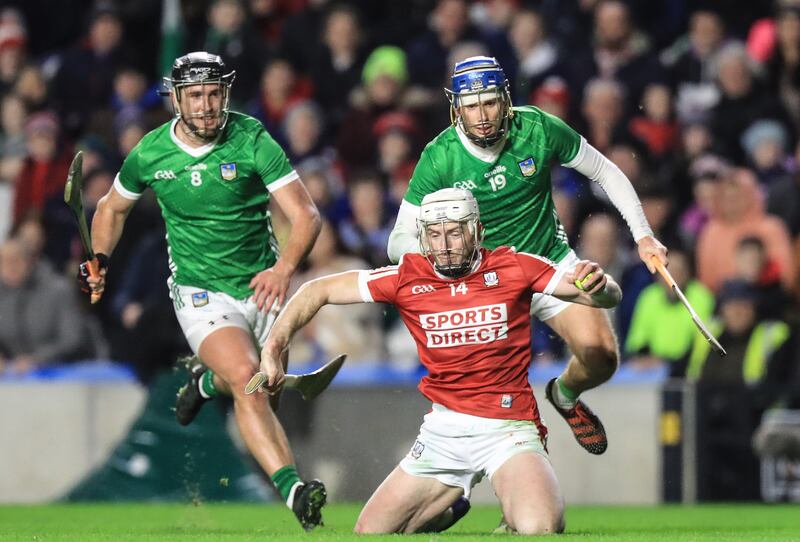 Cork’s Patrick Horgan with Ronan Connolly and Darragh O'Donovan of Limerick. Photograph: Evan Treacy/Inpho 