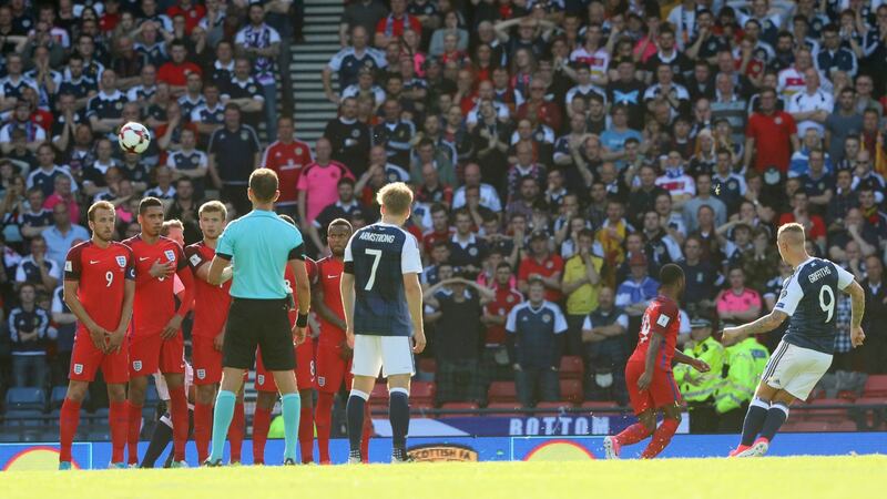 Scotland’s Leigh Griffiths scores his first goal from a free kick. Photograph: Russell Cheyne/Reuters