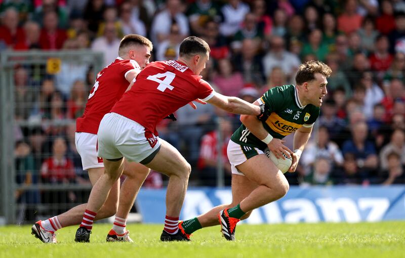 Dara Moynihan of Kerry breaks away from Cork's Maurice Shanley. Photograph: Bryan Keane/Inpho