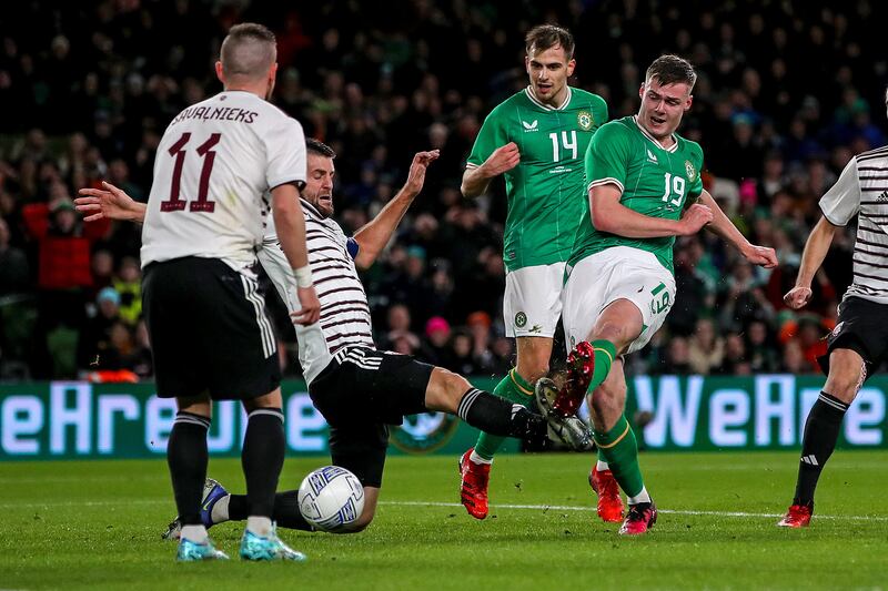 Ireland's Evan Ferguson scores against Latvia on Wednesday night. Photograph: Ryan Byrne/Inpho