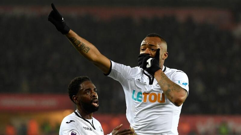 Jordan Ayew of Swansea City celebrates after scoring his side’s equaliser in the Premier League game against Crystal Palace at Liberty Stadium. Photograph: Stu Forster/Getty Images