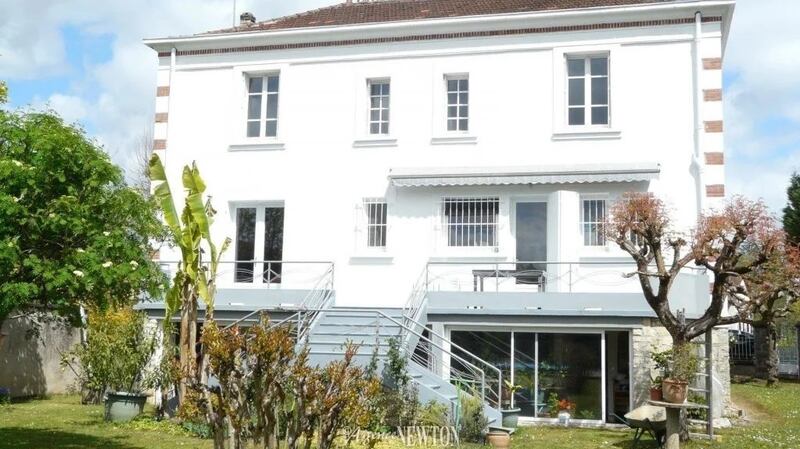 This French four-bed has an enclosed garden and swimming pool
