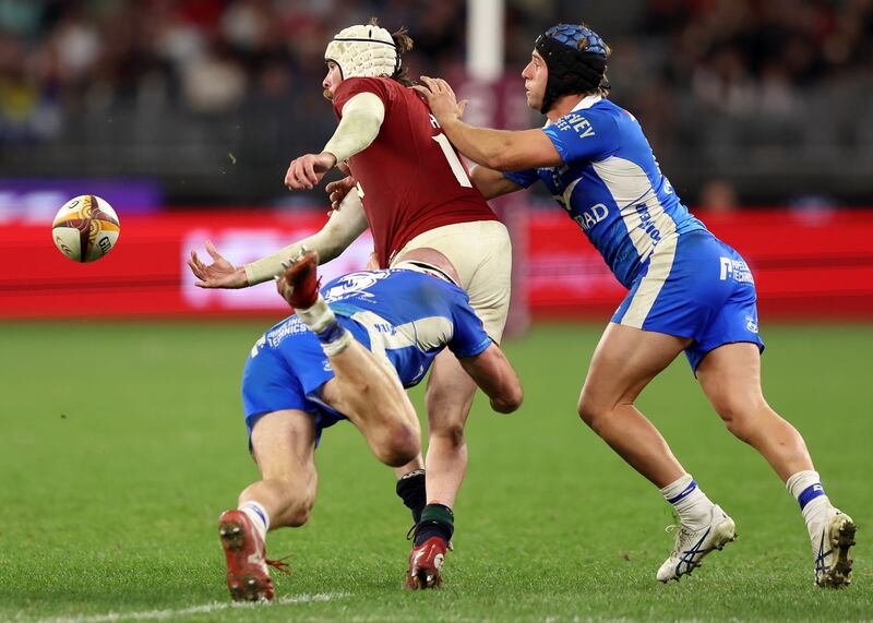 Mack Hansen offloads during the tour match against Western Force. Photograph: Janelle St Pierre/Getty Images