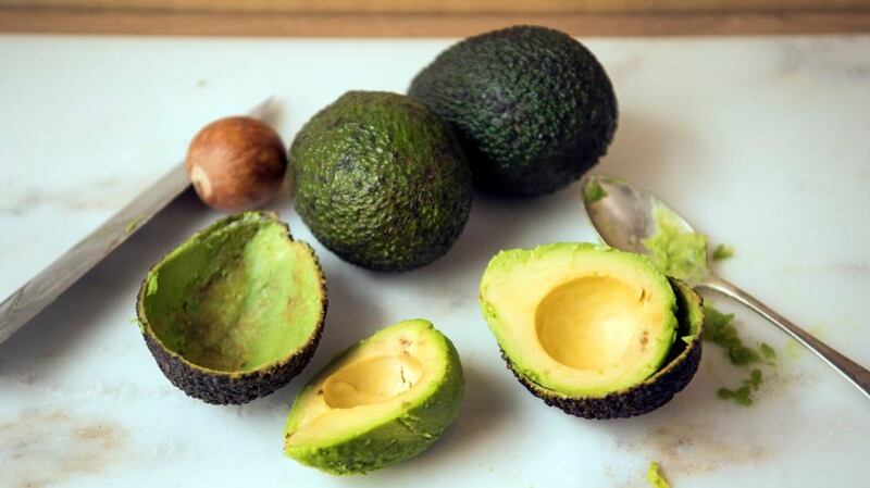 Run a dessert spoon between the flesh and skin of your avocado. Photograph: Linda Nylind/The Guardian