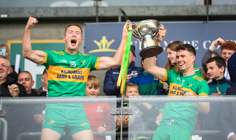 Rhode's Darren Garry and Niall McNamee lift the trophy. Photograph: Evan Treacy/Inpho
