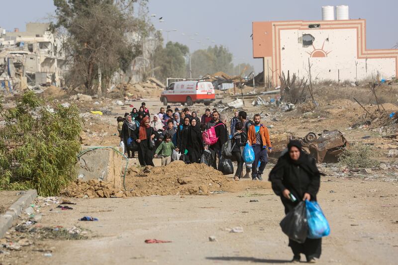 Displaced Palestinians from northern Gaza Strip passing through an Israeli checkpoint on their way south. Photograph: Samar Abu Elouf/The New York Times
                      