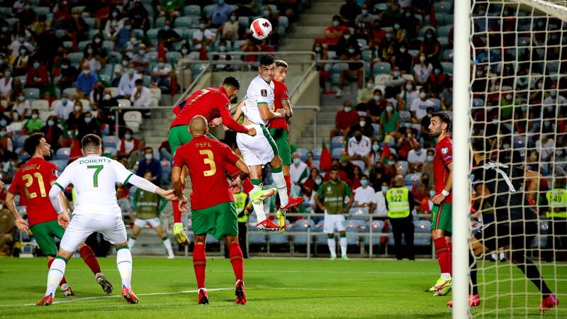 John Egan heads the Republic of Ireland into the lead during the  World Cup qualifier at  Estadio Algarve in Almancil. Photograph: Ryan Byrne/Inpho