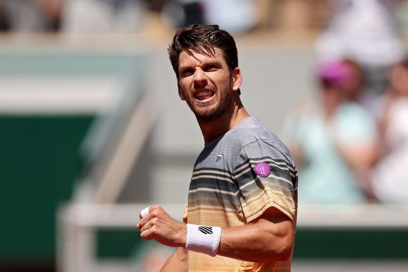 Cameron Norrie of Great Britain celebrates winning match point against Benoit Paire of France. Photograph: Julian Finney/Getty