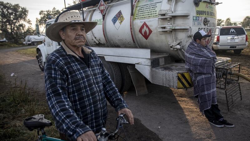 Resident survey the devastation following the explosion. Photograph: Alejandro Cegarra/Bloomberg