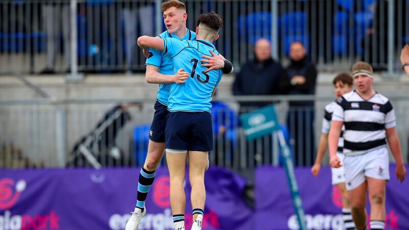 Chris Cosgrave (#13) celebrates scoring a try with St Michael’s team-mate  Mark O’Brien during the Leinster Schools’ Senior Cup semi-final at Donnybrook. Photograph: Tommy Dickson/Inpho