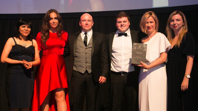 Richard Flood, Managing Director, Castlerock Contracting & Developments presents the Building of the Year - Office (Small) award to the Reddy Architecture + Urbanism team.
