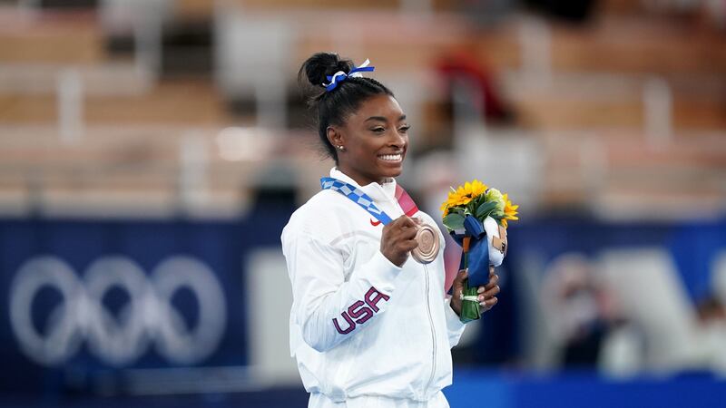 Biles on the podium with her bronze medal. Photo: Mike Egerton/PA Wire
