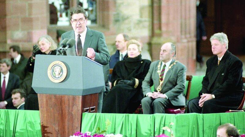 John Hume introduces US president Bill Clinton in Derry in 1995. Clinton made a point of visiting Derry with Hume. The message was clear – peace would not have occurred without Hume. File photograph: Joe St Leger